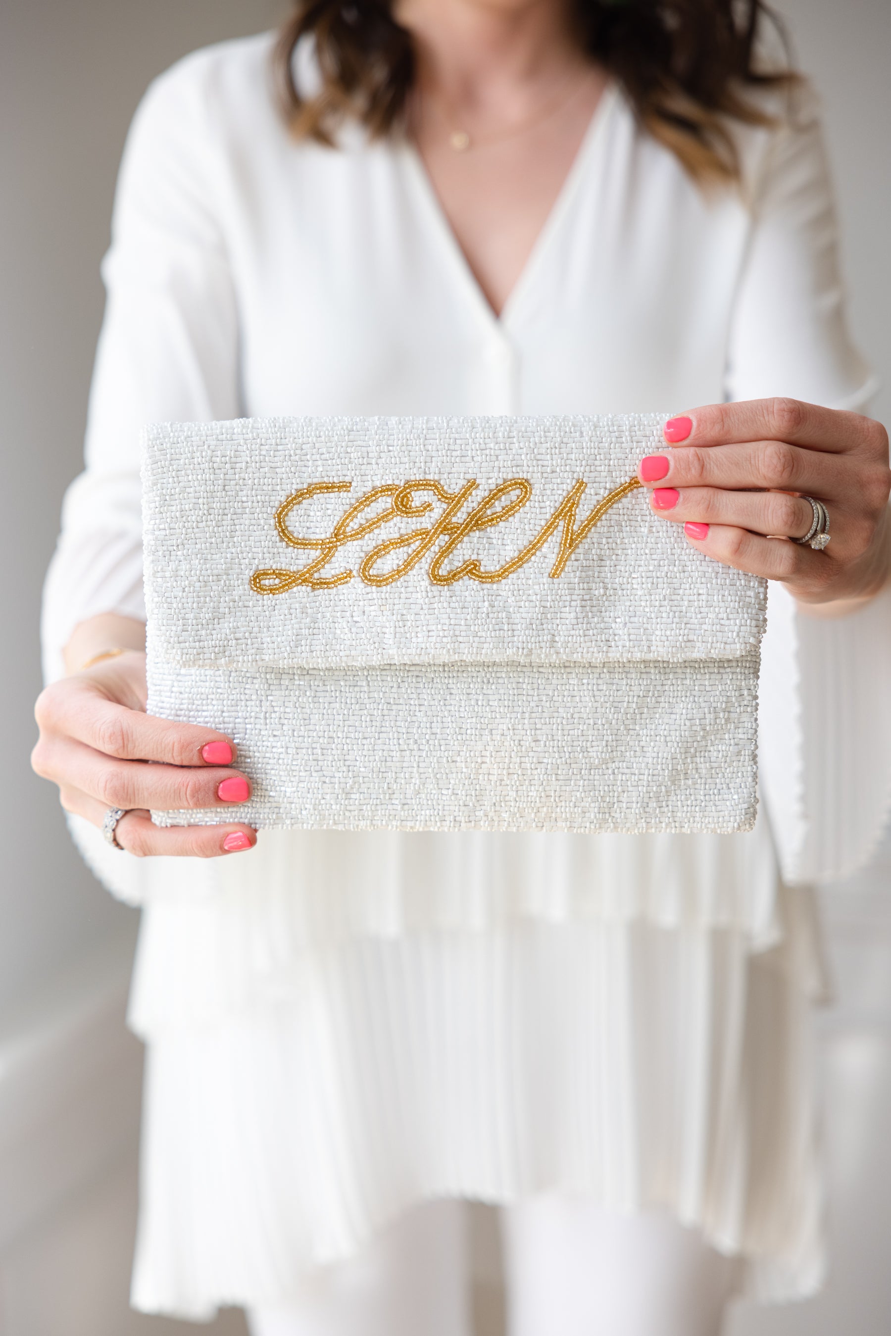 custom beaded clutch with cursive monogram